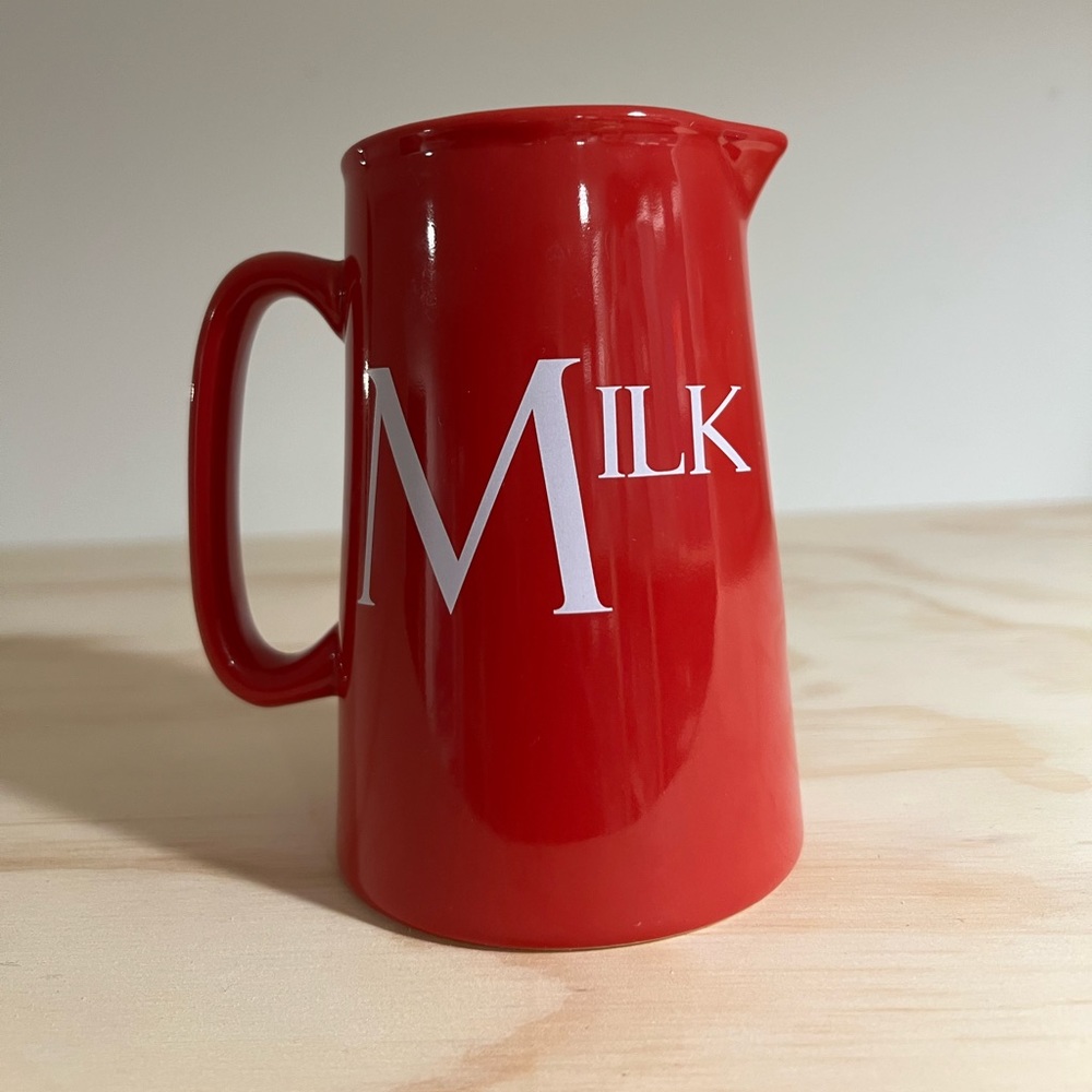 Red ‘Milk’ pitcher.